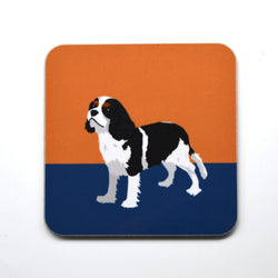 High gloss melamine cork backed coaster. Handmade in the UK, with a sustainably sourced Eucalyptus board base, a full melamine surface, with cork backing. 3.2mm thickness board Square with round corners. Size: 100mm x 100mm Made and printed in the UK. Coaster, King Charles Spaniel, The Dog Collection